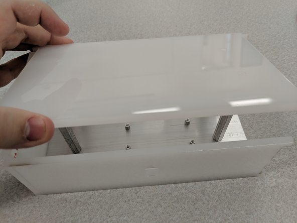 Slide the three sides over a completed baseplate.  This will let you check orientation of the top panel.
