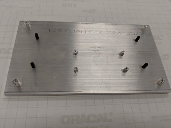 Orient the screws so that the hex wrench hole is facing down towards the bottom of the baseplate.