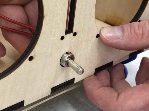 Take the switch assembly and remove the panel mount nuts from the switch.