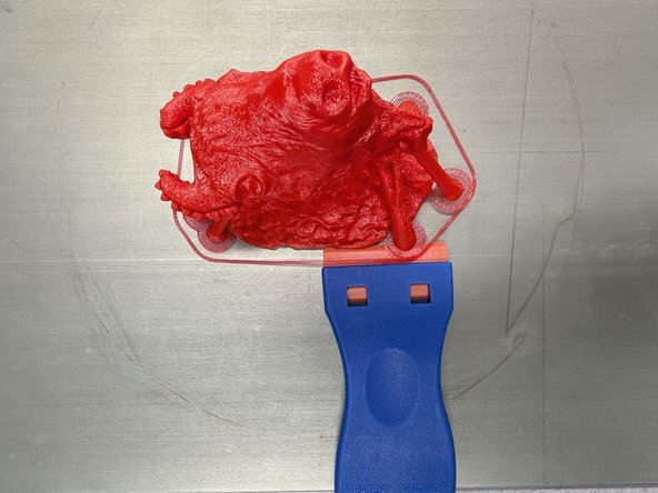 Once you've removed the print surface you can flex it (don't be afraid to apply a good deal of pressure/flex) to detach your print from the surface.