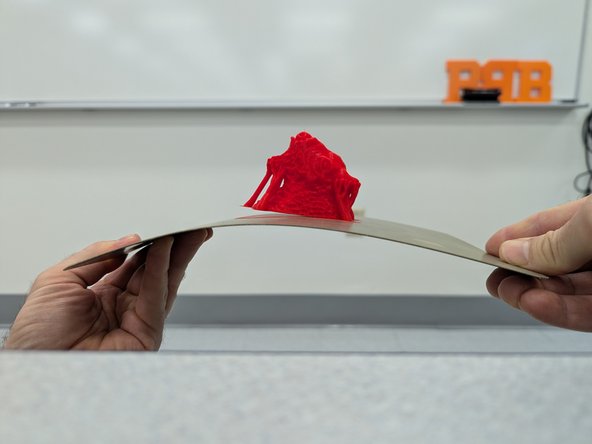 Never remove parts while the print surface is still attached to the printer.  This can throw off calibration, causes errors with bed leveling, or otherwise damage the printer.