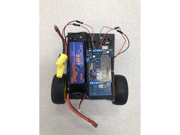 Use velcro tape to attach the LiPo battery to the top of the robot.