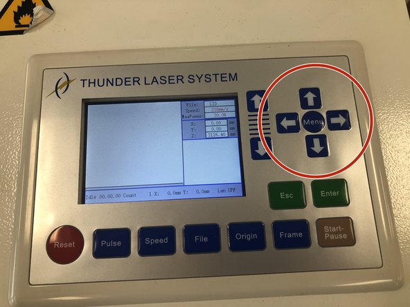 Move the engraver head to the top left corner using the right most arrows. Press   the top arrow and the left arrow till you have reached the top left corner of the bed.