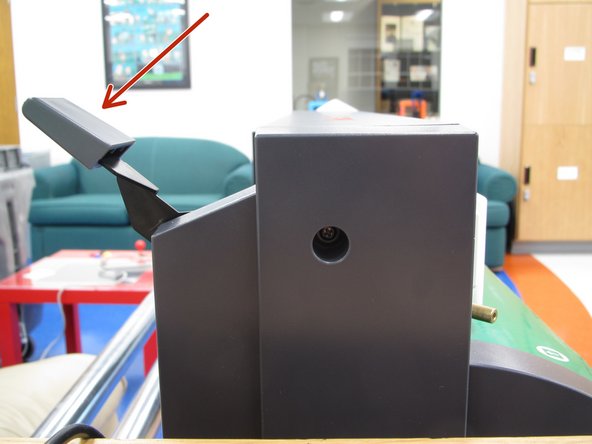 Lower the loading lever and remove the material or the remaining vinyl roll.