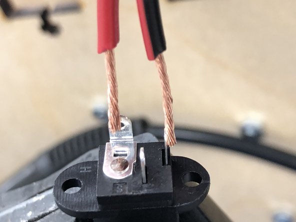 Dip in flux, then melt a drop of solder onto each of the ends and the side-facing lead (red) and the bottom lead (black)