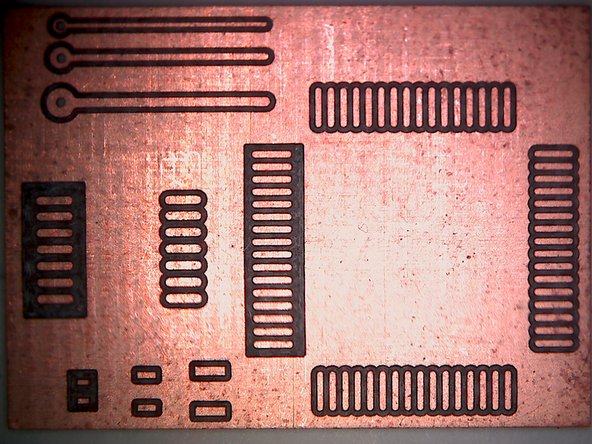 The mill uses a subtractive process to remove small amounts of copper from a sheet of copper clad board.