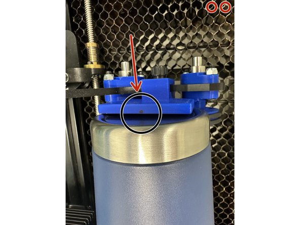 Then carefully move the laser head from the left side to the black marker dot on the right side of the rotary tool, shown in picture 2.