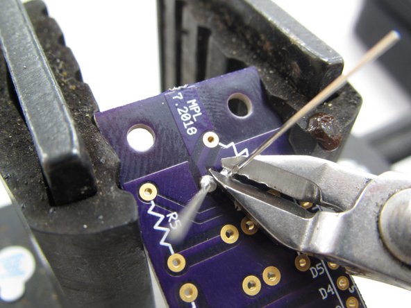 The vice also allows you to push up on the plastic case of the LED to keep it flush while soldering in place.