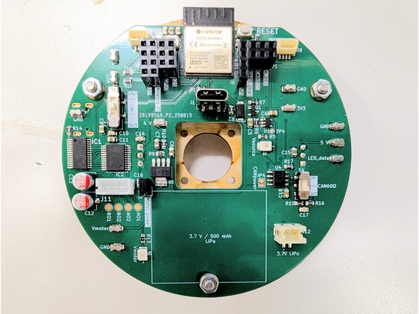Thread a nut onto each of the three protruding bolts on the front side of the PCB.  Hand-tighten all three nuts.