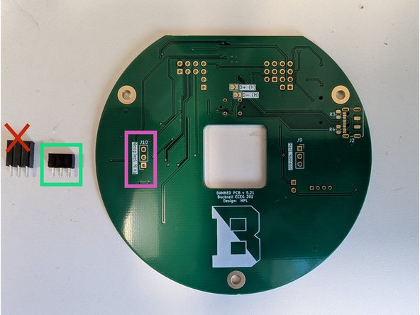 There are two 3-socket headers in your parts kit.  Locate the shorter of the two headers.  This socket will mount on the bottom side of the PCB and be soldered on the top side.  See the green highlighted connector in the first image.
