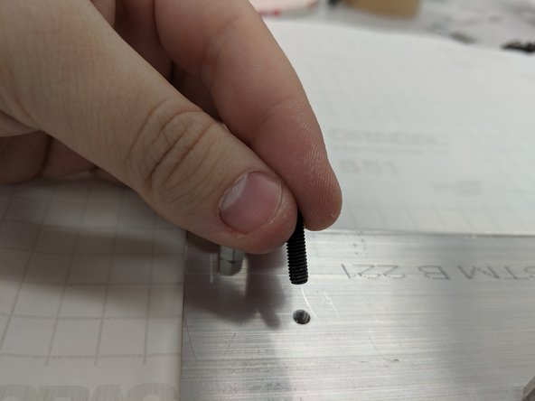 Secure the M4 set screws in the M4-threaded holes. These are will hold the long standoffs that support the box enclosure.