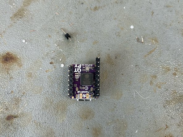 Solder male header pins onto the QTPY and female header pins onto the NeoPixel driver.