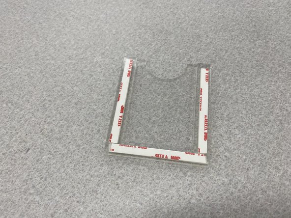 Use three strips of VHB tap to attach the U-shaped clear spacer to the card holder as shown in the first figure.