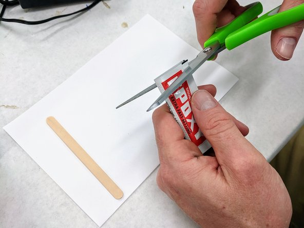 Pick up a packet of epoxy from the supply provided.  You will also need a popsicle stick and an index card.