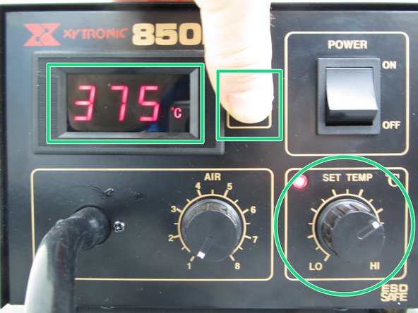 Being careful to avoid the airflow of the tool, push and hold the red Set Temp button while adjusting the SET TEMP knob.  This will allow you to view the desired set temperature.  Configure the tool to 375C for the solder paste used in the Maker-E.