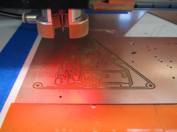 The mill will stop moving and CircuitPro will display a Confirmation of focus height window.  When you see this window, lift the mill lid.  The bit will stop spinning and CircuitPro will temporarily display a window asking you to close the lid.