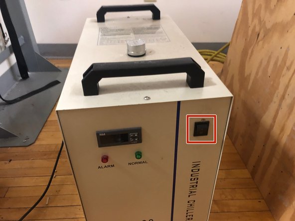 The laser cutter system has three main components, all of which must be turned on as the first step in operating the system.