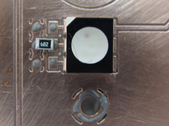 This package does not have any leads that stick out, which makes placement slightly more difficult.  When placing the component, bring it down so that it is almost touching the paste.  Then view the PCB directly (as opposed to the microscope display) to aid in proper placement.