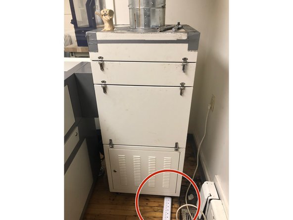 Next, turn on the chiller located to the left of the laser cutter. It will beep several times.  This is normal.