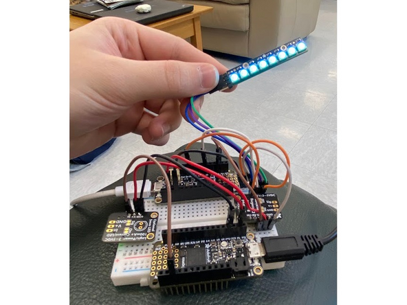 To earn a badge for this component, use the included NeoPixel and jumper cables to add lights onto the receiver Feather. Then change your code so that instead of converting into hex, the Feather will set the NeoPixel to the color set in the transmitter code.