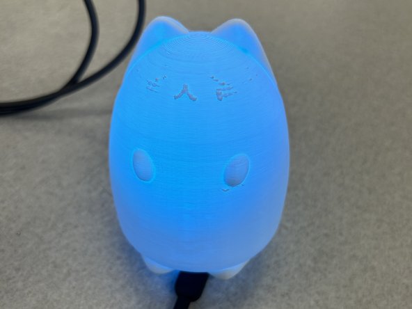 Insert your NeoPixels and microcontrollers into the lamp.