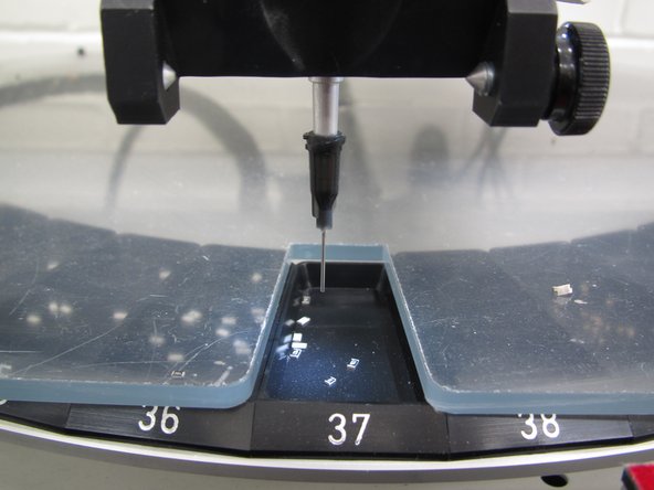 Using the green buttons on the placement head, rotate the carousel to open the bin containing the first component you wish to place.  Here are some guidelines when choosing which order to place components: