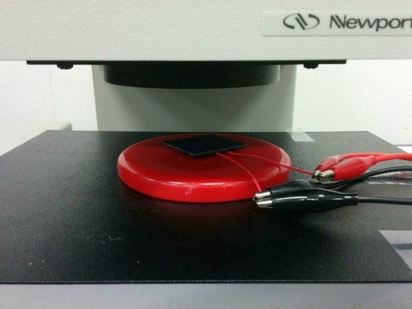 The working distance between the bottom end of the hole to the top of the solar cell should be around 2 inches. Currently the distance is adjusted by adding or removing paper from the bags under the metal box.