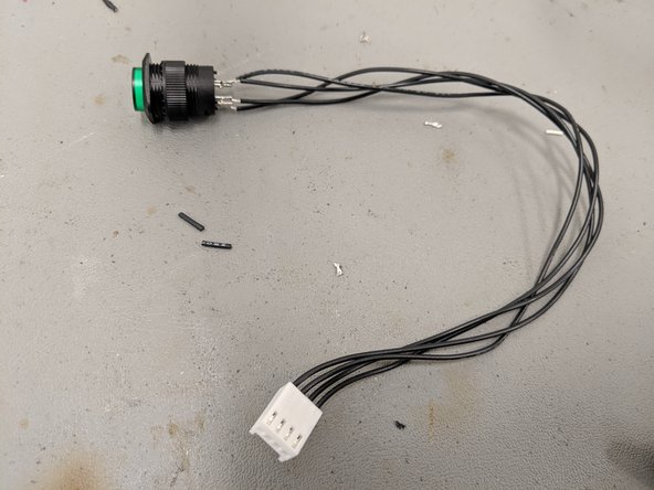Use the wiring diagram in the first figure to match the wires from the button to the correct holes in the connectors.  The second figure shows how the wires should connect to the PCB.