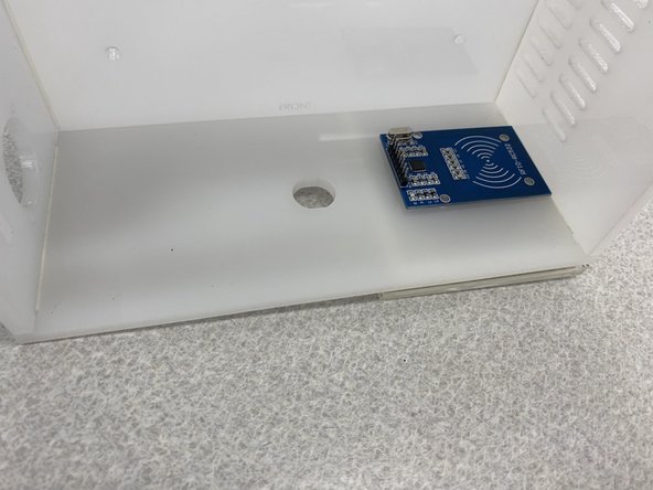 Being careful to align the card holder as shown in the second figure, attach the complete card panel to the left side of the front panel.  Make sure to leave some space for the push button (about 1/4&quot; from the hole, minimum)