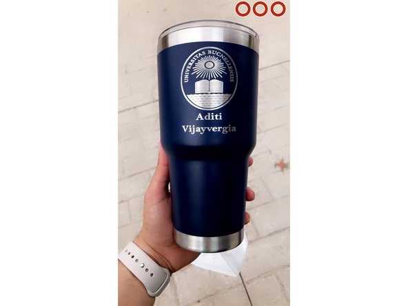 Go to conference room. Apply water on tumbler and scrub off excess coating on tumbler. Ta da, you should have an engraved tumbler now.
