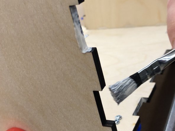 You will need wood glue at this point. Find a scrap of wood of piece of paper and squeeze out a 1.5&quot; or so blob. You'll also need a brush.