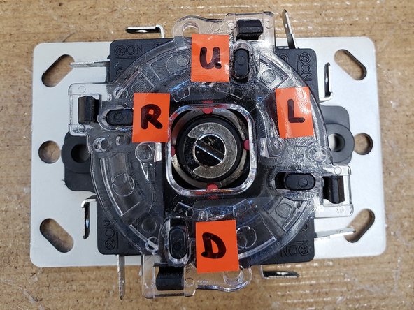 Label the four corners of the metal plate side of the joystick, with the each corner corresponding to the up, left, right, and down switches respectively. You can move the joystick to identify each switch.