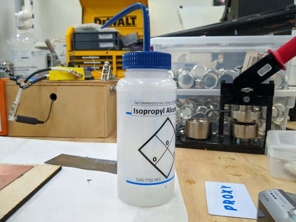 Once you are satisfied with the paste application you can remove the PCB from the stencil printer. Carefully lift your PCB from the printer, being careful not to smear the paste. Set the PCB aside.