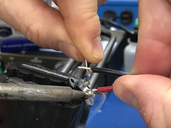 Slide two ~1&quot; segments of heat wrap over each wire.  We will shrink these on after soldering to protect the wires.