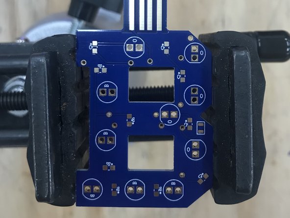 Whenever possible, try to secure your PCB in a vice with a heavy base.  This will prevent your board from moving around while you work.