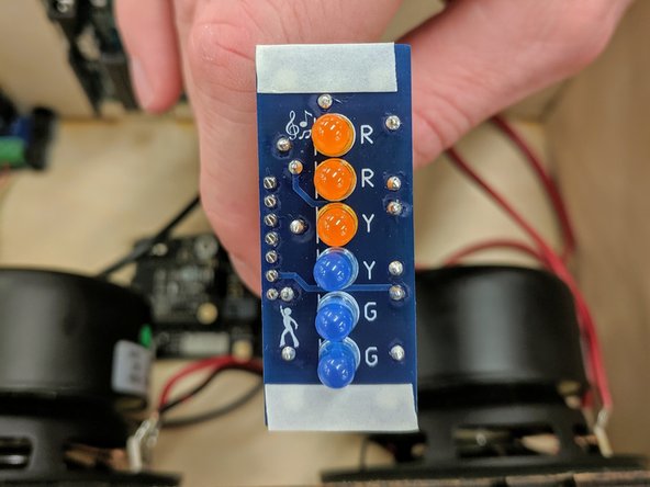 Insert one of the end wires of the ribbon cable into the GND slot along the edge of the Arduino closest to the USB connector.