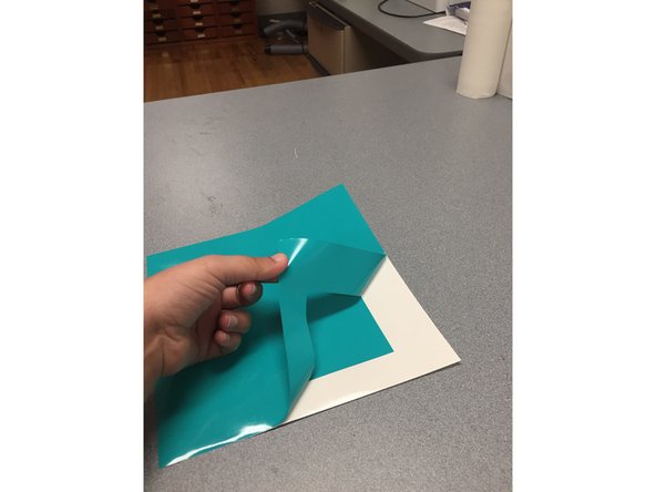 Now that your piece has been cut on the machine you want to peel away any surrounding vinyl that you do not want. The parts you don't want are called the negative.