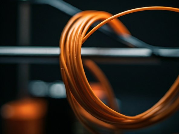 TPU is extruded at around 220 deg C. It may require a 50 deg C heated bed and does not require an enclosed printer.