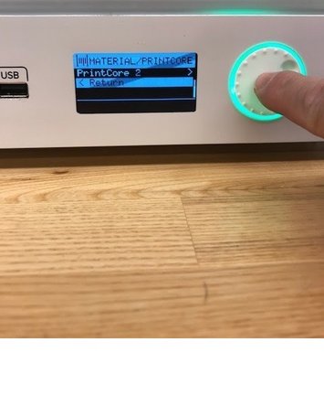 Text will scroll across the bottom of the display, this will tell you what type of material and how much is on the material spool.