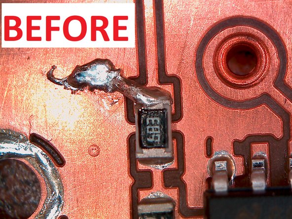 After lifting the iron and the copper braid the solder bridge should be removed.  If it is not completely removed you may need to apply more pressure to the braid, or leave the iron on for a longer period of time.