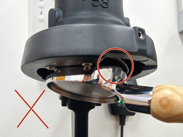 Be sure to have the portafilter seated properly.  The image shown with the green check is an example of a properly mounted portafilter.