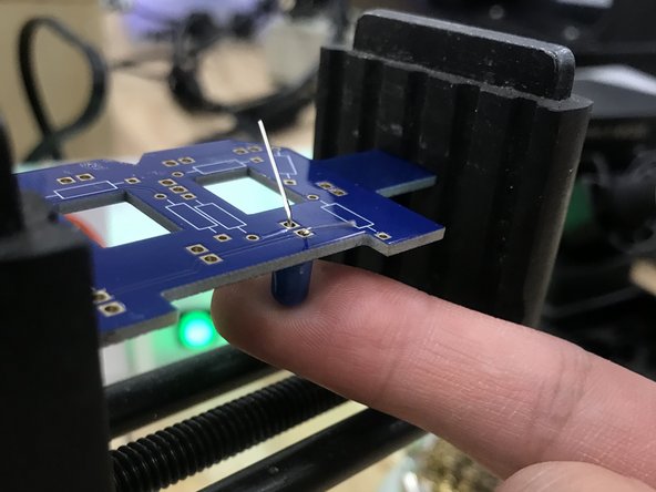 Secure your PCB in a vise.  Apply some pressure from underneath to make sure the Resistor/LED is sitting flush with the board.  Use caution when doing this with your finger, as heat will travel rapidly from the metal leads you are soldering into the rest of the package.  This is more pronounced with completely metal components or packages.