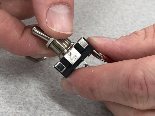 Remove the rubber bands from your speaker box.  It's unlikely the glue is fully cured, so be gentle.  However, it should be acceptably stable to work with at this point.