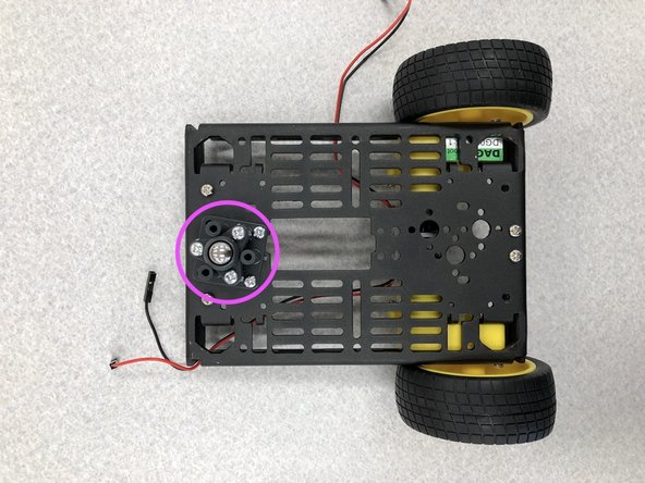 Attach the caster to front of the cart using the given screws.