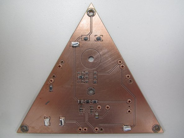 Be careful with the test points, it is easy to mistake the pads for the 100 μF capacitor as pads for two test points.