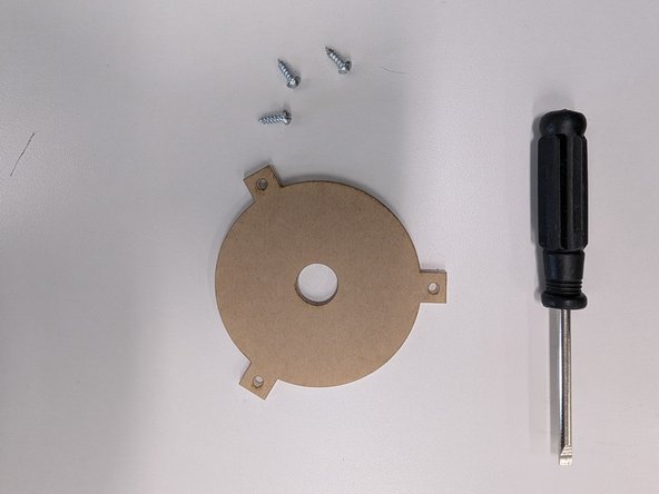 Locate the acrylic diffuser and the three wood screws (pointy ends).  You will also need a flat blade screwdriver.