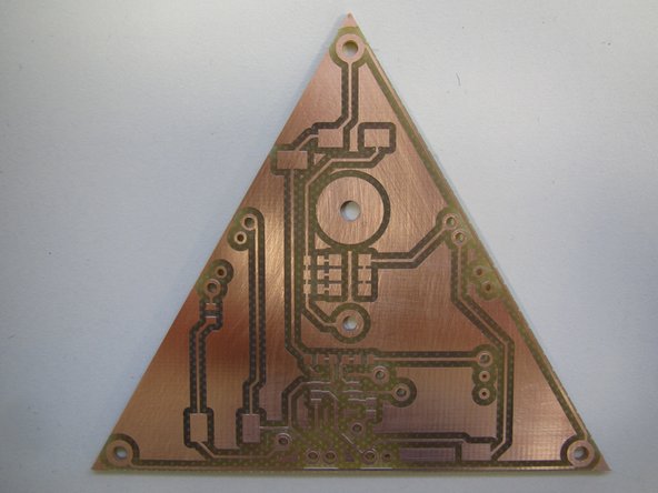 Locate a piece of 0000 gauge steel wool in the drawer below the PCB mill.