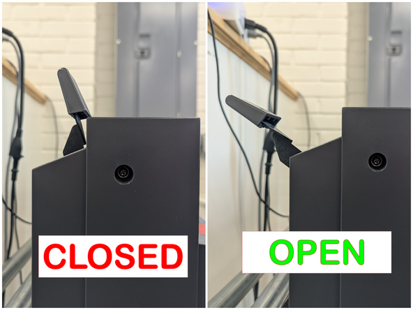 Push the lever arm back to open the vinyl clamp.