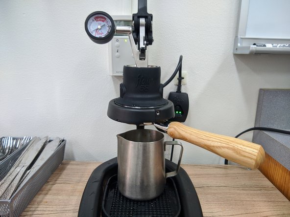 Remove your espresso cup from the drip tray and replace it with another mug.