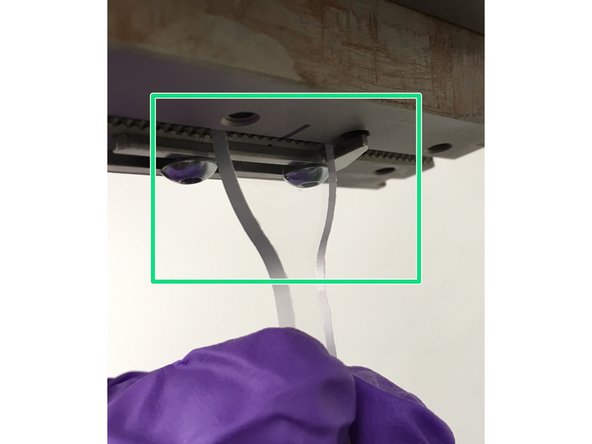 Using the software interface or to pendant, position the crosshead far enough apart that your sample when slid into the one grip is not within the other.